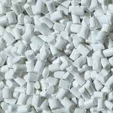 A close-up of high-quality, natural ABS pellets, a high-strength raw material for industrial 3D printing.