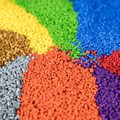 Colorful piles of high-quality PETG 3D printing pellets, ideal for custom filament extrusion and durable parts.