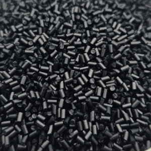 A pile of black conductive ready-to-mold pellets for injection molding and extrusion.